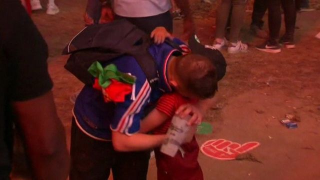 Portuguese boy hugs French fan after Euro 2016 Final