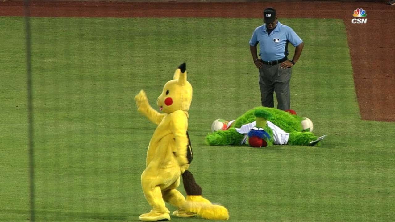 Philly Phanatic captures Pikachu during Phillies game