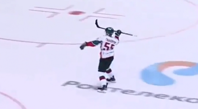 KHL player chucks his hockey stick in the net for a goal