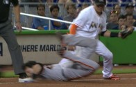 Buster Posey slides into 3rd base with his head hitting the bag