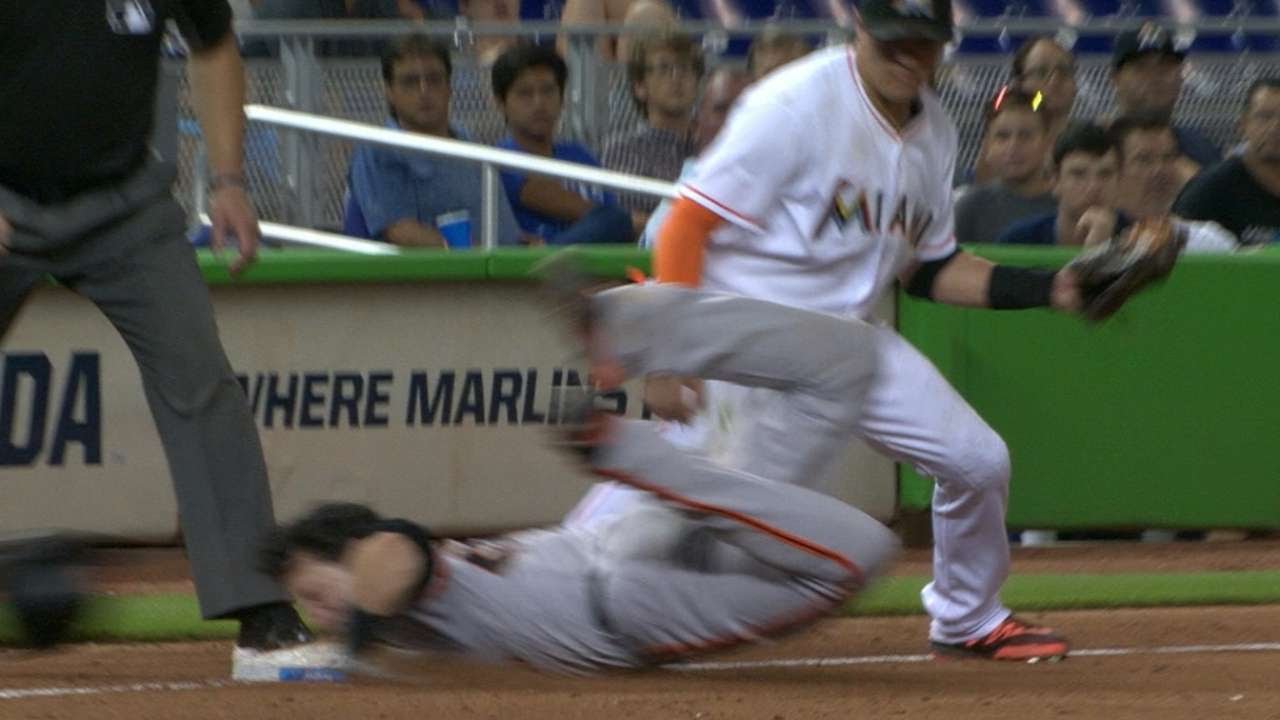 Buster Posey slides into 3rd base with his head hitting the bag