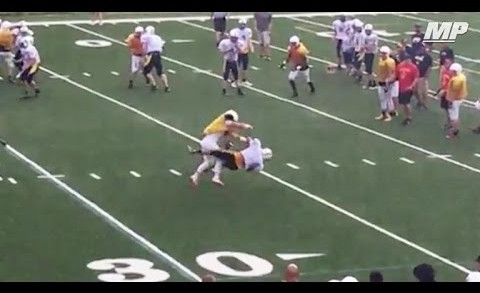 High schooler lays a bone crushing hit in scrimmage