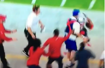 Julian Edelman crashes into a ball boy during Sunday Night Football
