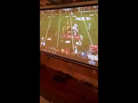 Georgia Bulldogs fan smashes his hand through a window while celebrating
