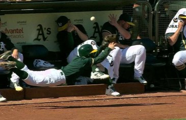 Oakland A’s ball boy dives to try and protect A’s pitchers