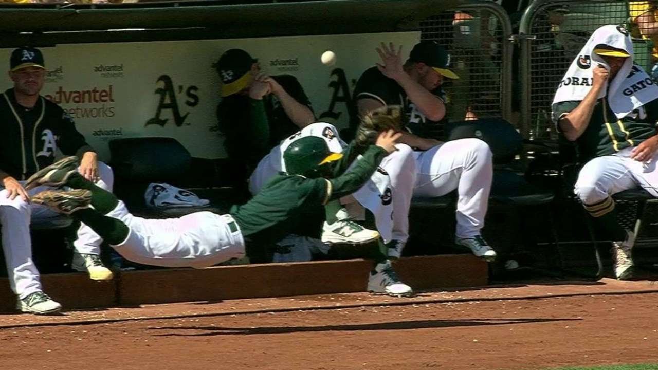 Oakland A's ball boy dives to try and protect A's pitchers