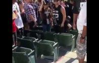 Raiders fan gets clocked for knocking glasses of another Raiders fan