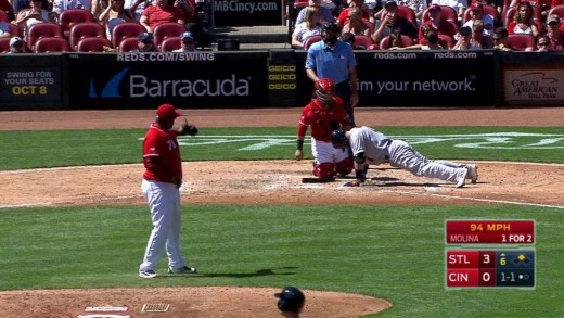 Yadier Molina does pushs up at the plate