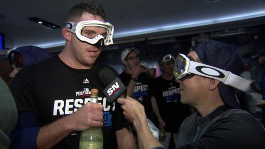 Blue Jays pitcher Joe Biagini pretends champagne bottle is a microphone