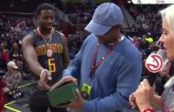 Atlanta rapper Gucci Mane gives away a Rolex watch to a fan at the Hawks game
