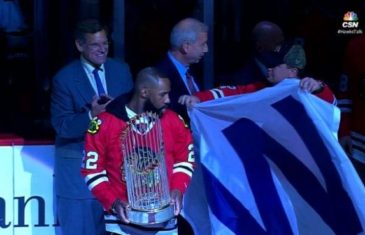 Cubs bring World Series trophy to Blackhawks game