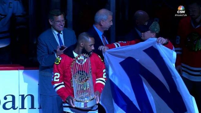 Cubs bring World Series trophy to Blackhawks game