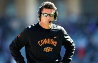 Oklahoma State head coach Mike Gundy gets popped in the face by his own player