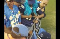 Tennessee Titans’ Taylor Lewan comforts crying Titans fan after loss
