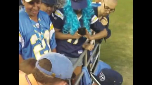 Tennessee Titans’ Taylor Lewan comforts crying Titans fan after loss