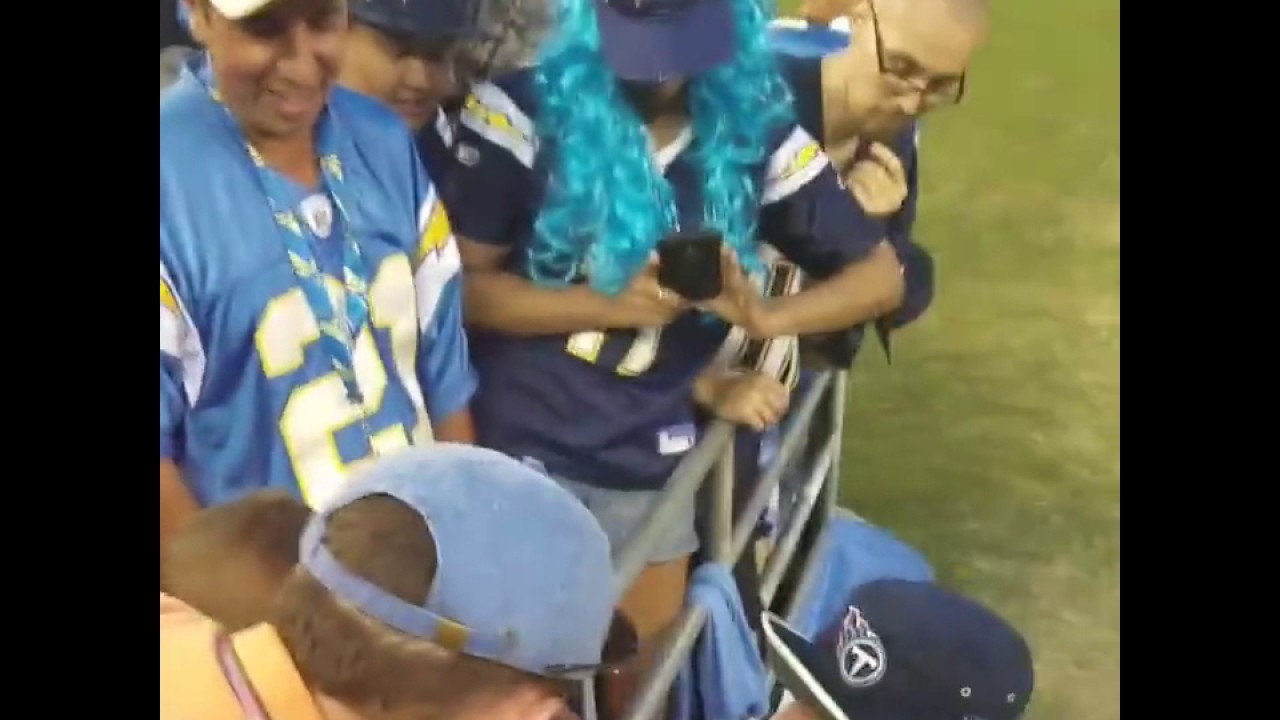 Tennessee Titans' Taylor Lewan comforts crying Titans fan after loss