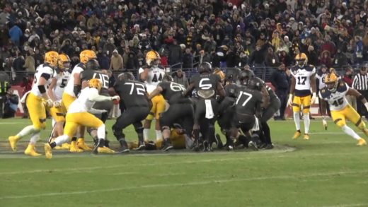 Army fans & students storm the field after their historic win over Navy