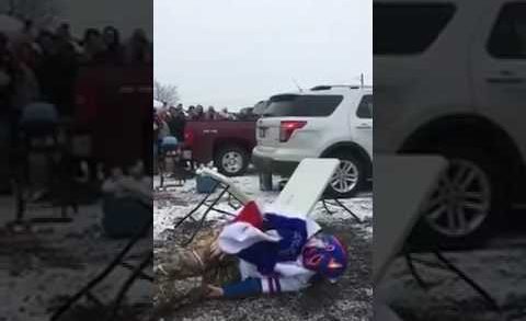 Bills fan gruesomely breaks his leg jumping onto a table (Warning: Graphic)