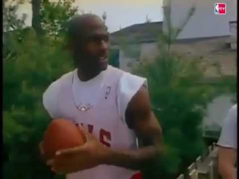 Michael Jordan throws a football 65 yards with ease