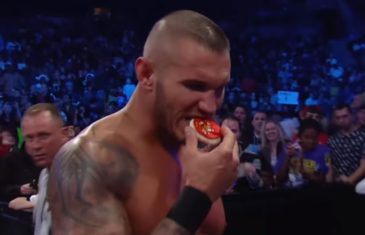 Randy Orton takes a moment to eat Christmas cookies during a match