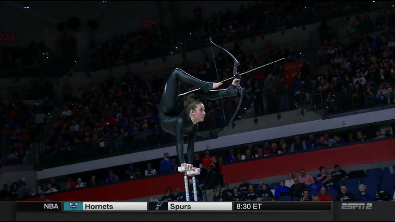 Florida Gators halftime performer shoots an arrow with her foot