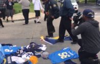 San Diego Chargers fan attempts to burn team flag at Chargers headquarters