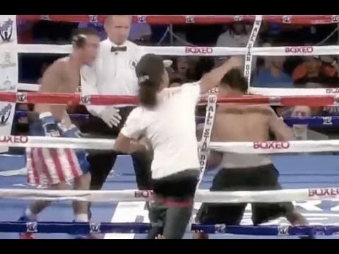 Spectator takes a swing at a Boxer during Live Boxing Match