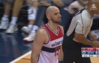 Marcin Gortat tips in a ball on his own basket