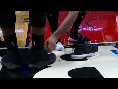 Bizarre: Robin Lopez ties Jae Crowder's shoe after an altercation with him