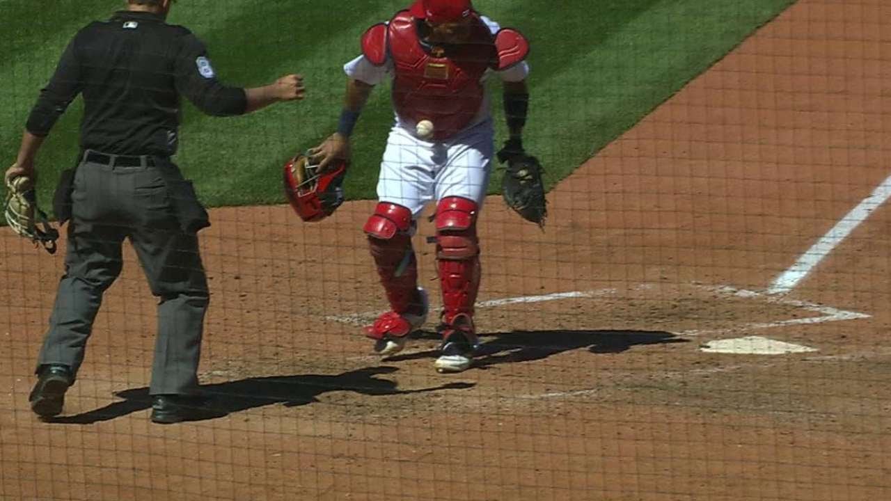 Bizarre: Yadier Molina has a baseball stick to his gear after strikeout