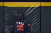 Marlins outfielder Christian Yelich slams into the wall at full speed to make a catch