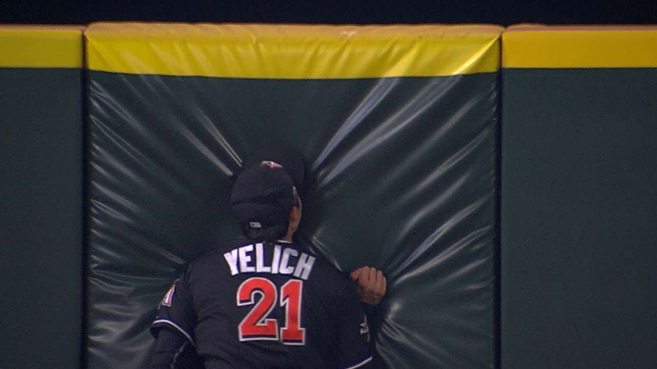 Marlins outfielder Christian Yelich slams into the wall at full speed to make a catch