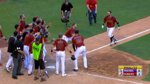 Arizona’s Daniel Descalso belts a walk off homer into the Diamondbacks pool