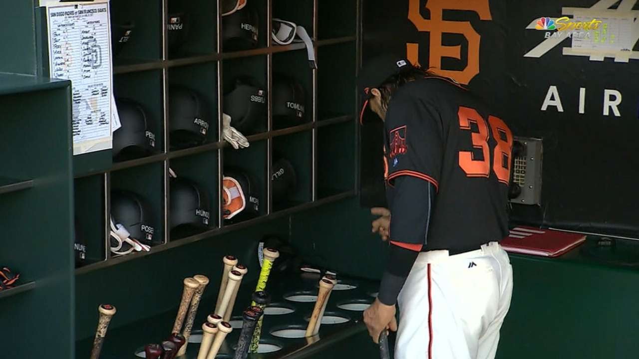 San Francisco's Michael Morse talks to his bats in between innings