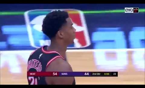 Hassan Whiteside with the two-handed swat and staredown