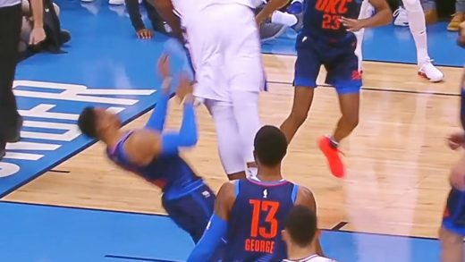 Joel Embiid stuffs one home over Russell Westbrook